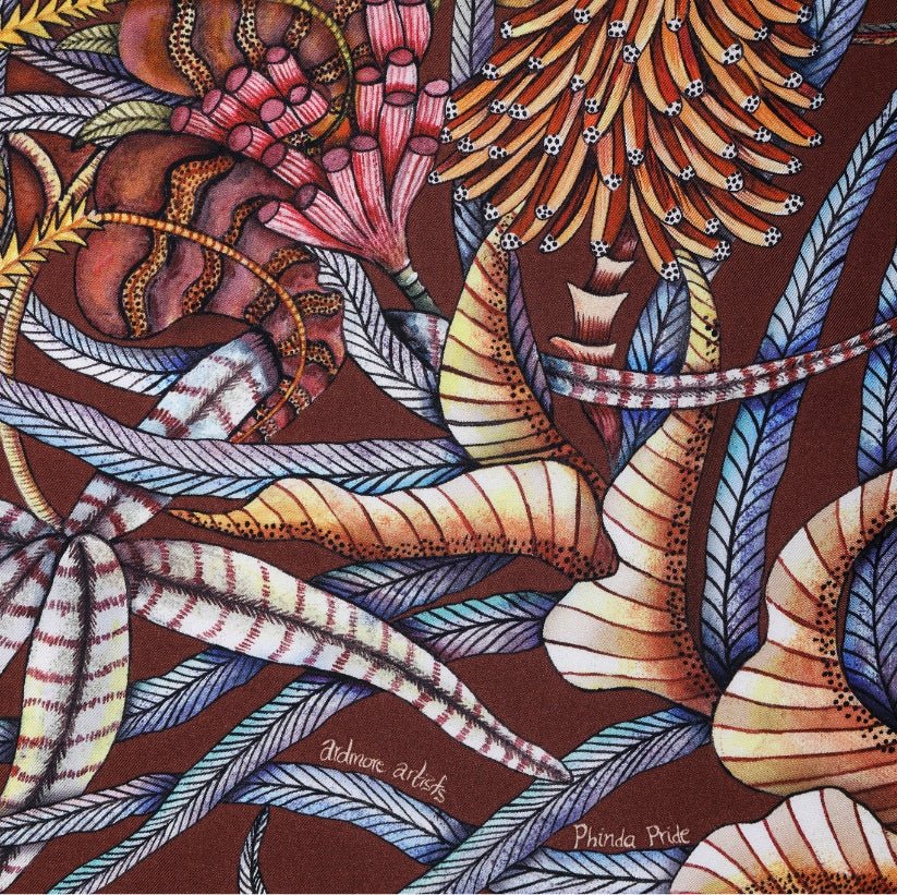 A close-up section showing the rich layering of leaves, vines, and intricate jungle patterns in warm, earthy hues.