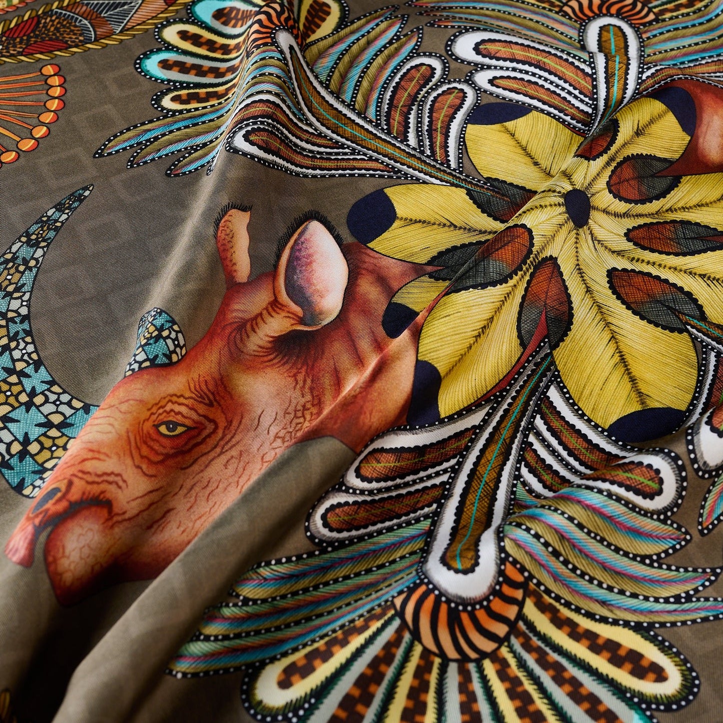 A detailed zoom-in of one rhino’s face, highlighting its rich texture, hand-painted details, and intricate botanical elements surrounding it.