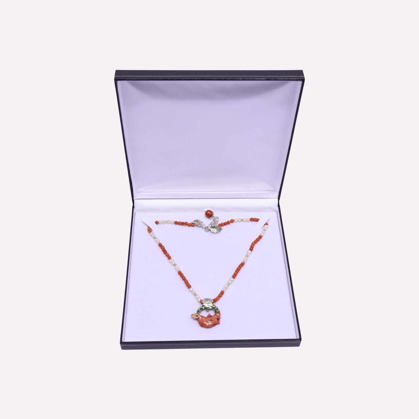 Coral Rhino with Leaf Bale Necklace