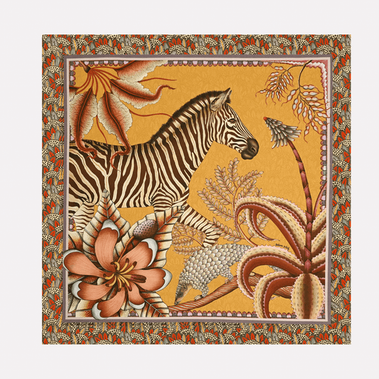 A full view of the Ardmore Thanda Stripe Napkin in Magnolia, featuring a zebra and pangolin among lush African flora, framed by an intricate patterned border.