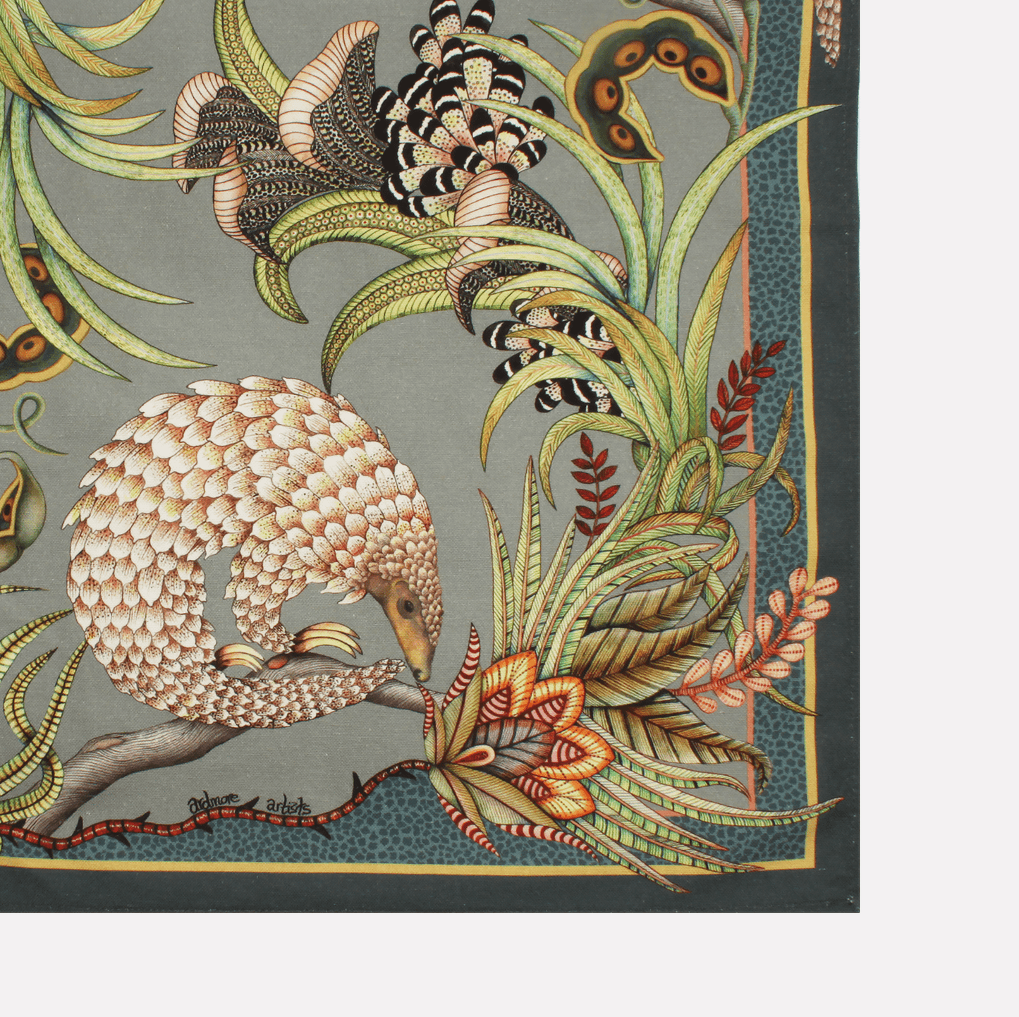 A neatly folded tea towel showcasing a mix of pangolin and plant motifs, elegantly designed with earthy tones.