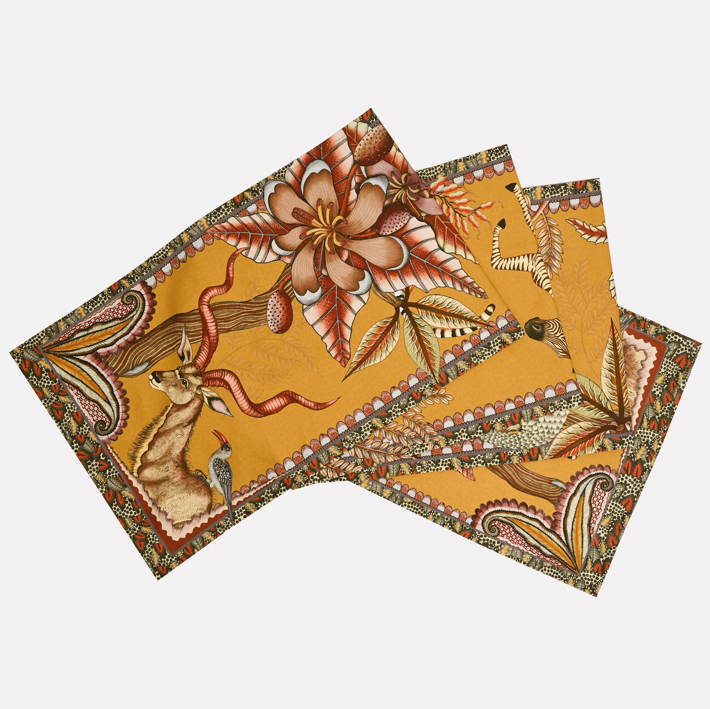 A neatly arranged set of Ardmore's Pangolin Park Table Runners in Flame, featuring a warm golden-orange background with intricate wildlife and foliage illustrations.