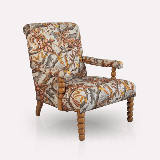 Ardmore Kudu Pod Chair in Pangolin Plum Velvet, featuring an intricate African-inspired botanical print, plush cushioning, and elegantly curved wooden legs.