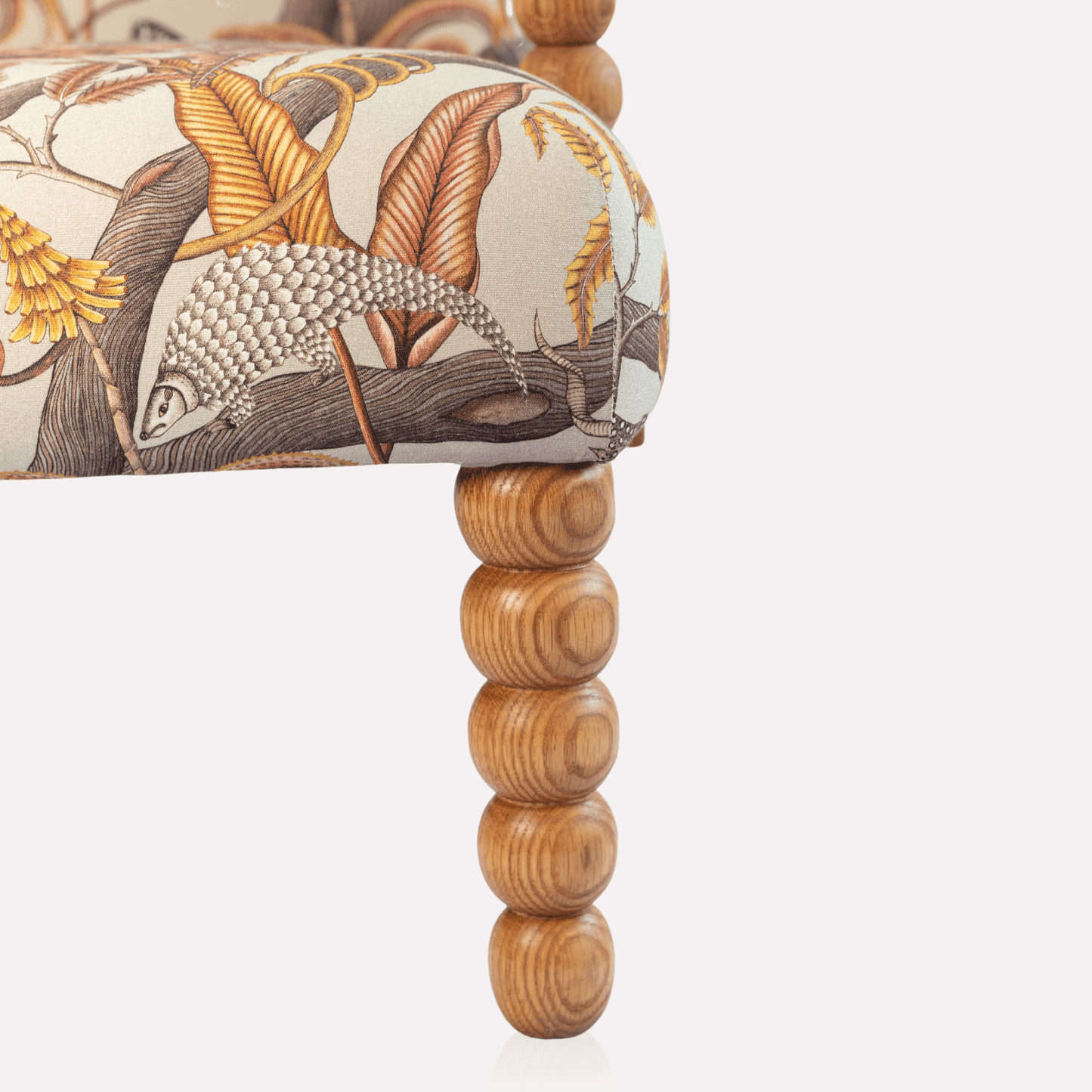 Additional perspective of the Ardmore Kudu Pod Chair in Pangolin Park Plum Linen, illustrating its rich tones, premium fabric, and elegant frame.