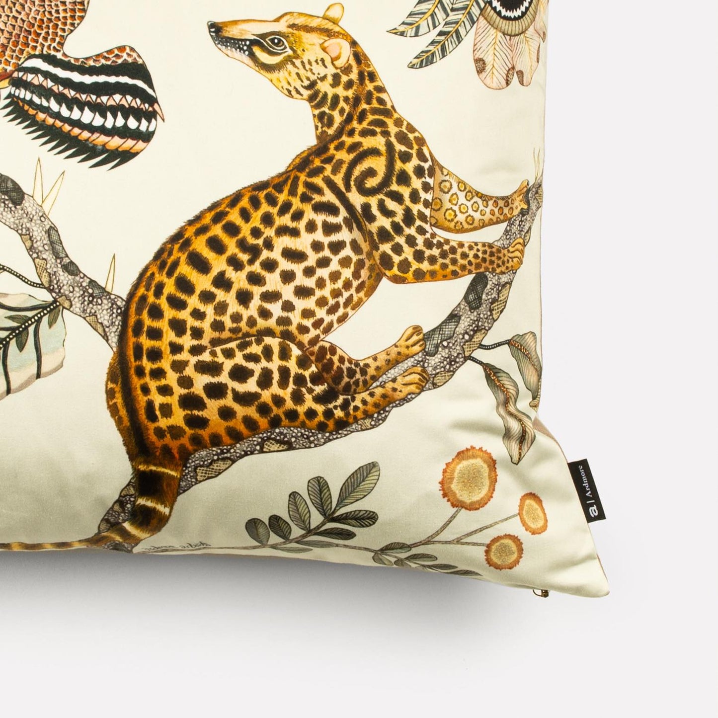 A perspective view highlighting the intricate animal and floral design that spans the front of the cushion cover.
