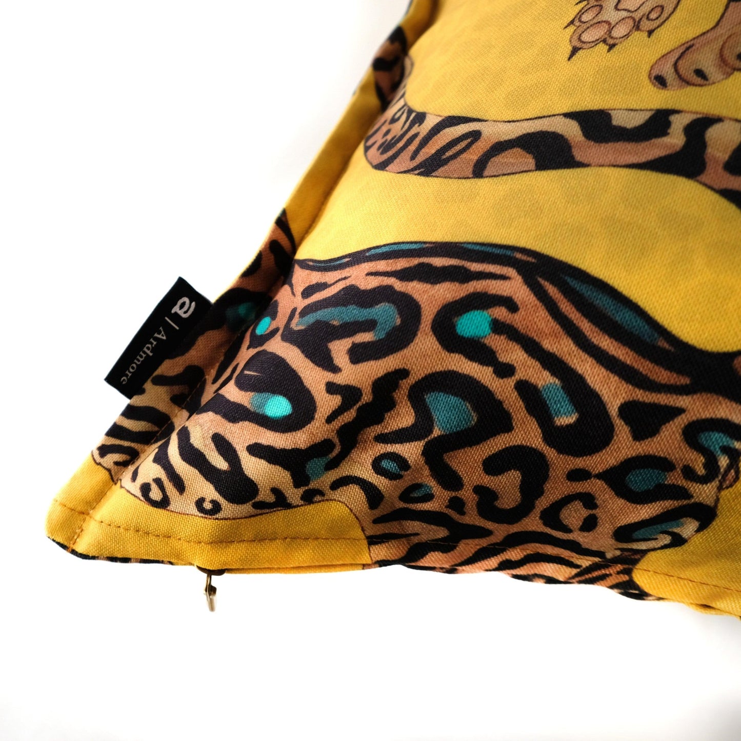 Side view of the Cheetah King Gold cushion cover, showing the elegant stitching and vibrant gold fabric with cheetah designs wrapping around the edges.