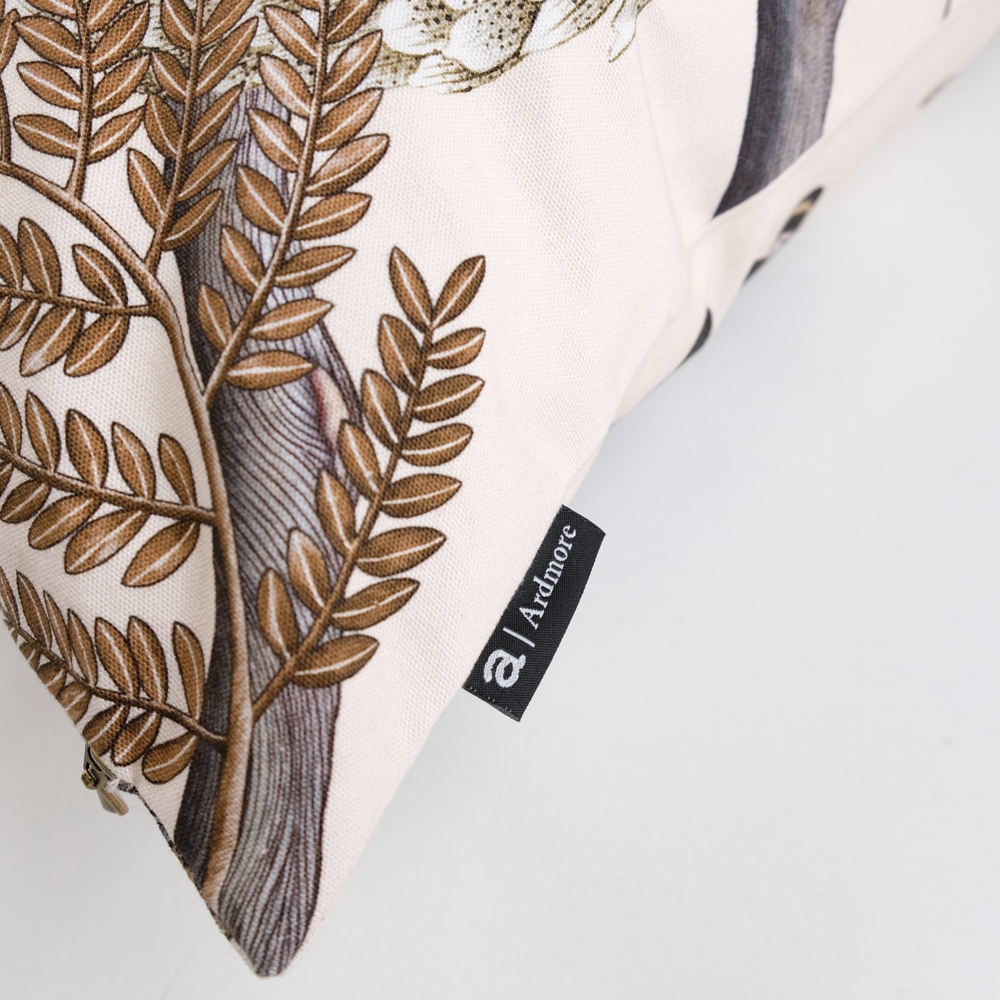 Close-up of the pangolin design on the Thanda Pangolin in Pearl Cotton Cushion Cover, highlighting the detailed artistry and earthy tones on the fabric.