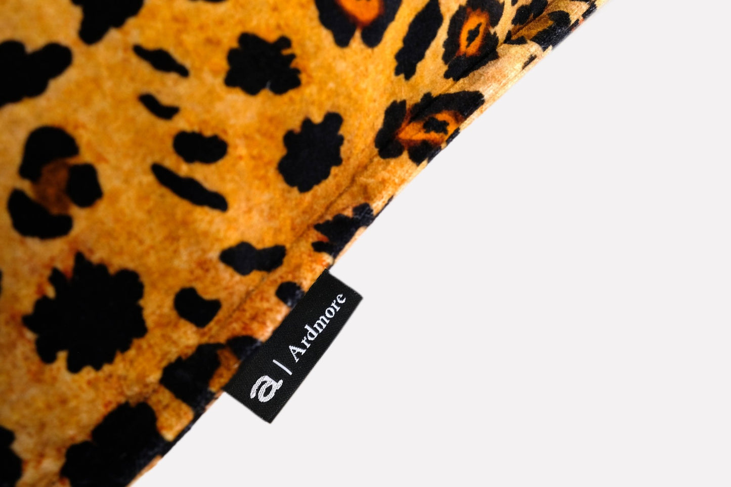 Back view of the Safari Spot Gold Velvet Cushion Cover, emphasising the seamless design and bold colour palette.