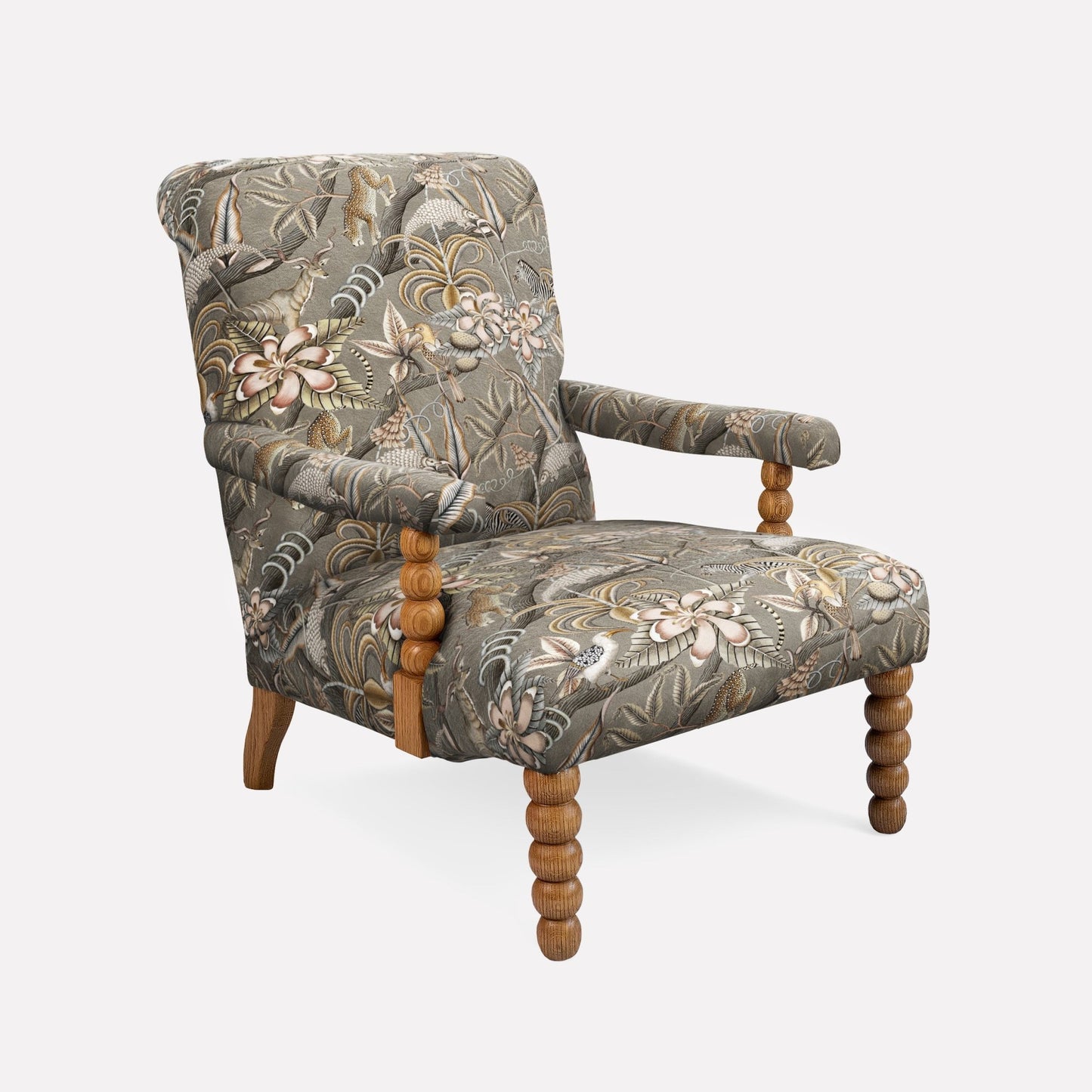 Side profile of the Ardmore Kudu Pod Chair in Pangolin Park Silver Velvet, featuring curved armrests, a high backrest, and elegantly carved wooden legs.