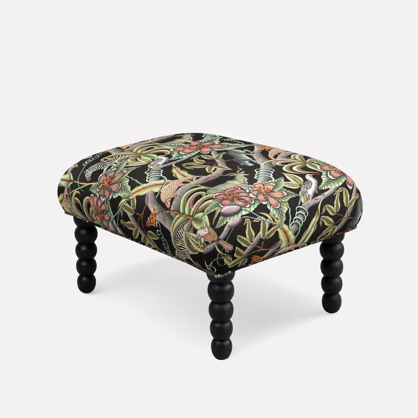 Ardmore Kudu Pod Ottoman in Pangolin Park Night Linen, featuring an intricate dark botanical pattern with black spindle legs, blending African-inspired luxury with contemporary design.