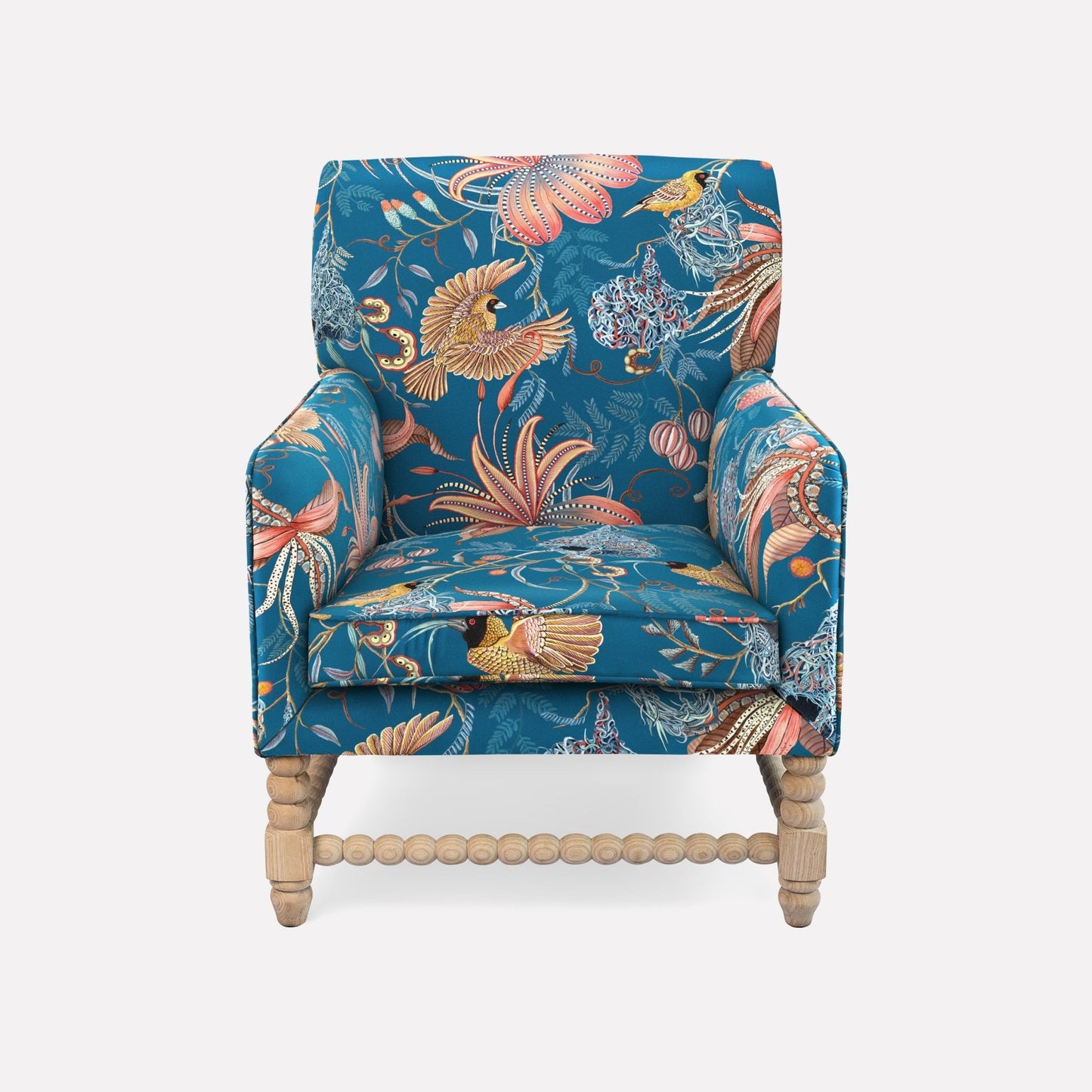The Ardmore Lucky Bean Chair, upholstered in Thanda Nests Midnight Linen, features a vibrant botanical design inspired by African artistry. Its plush seat, high backrest, and curved armrests provide both luxury and comfort, making it an exquisite centrepiece for refined interiors.