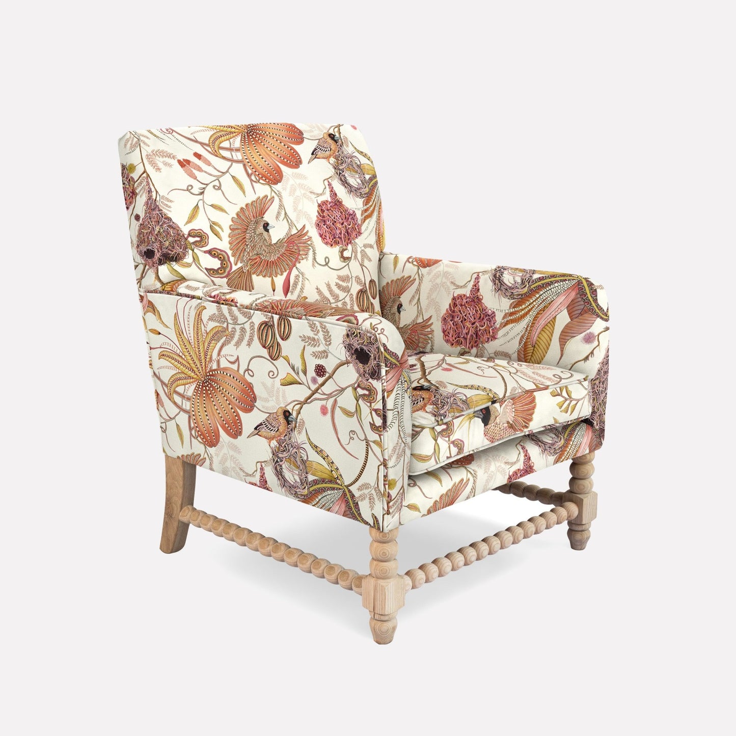 A side view of the Lucky Bean Chair, showcasing its intricate linen fabric, solid wooden frame, and hand-finished details. The warm plum and ochre hues of the floral pattern harmonise with the natural wooden legs, making it a sophisticated addition to any interior.