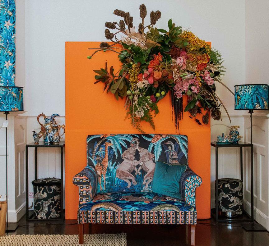 The sofa displayed in a showroom among other Ardmore furniture, highlighting its artistry.