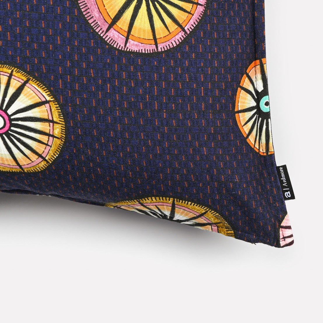 A zoomed-in shot of the cushion fabric, highlighting the vibrant circular motifs and fine digital print texture.