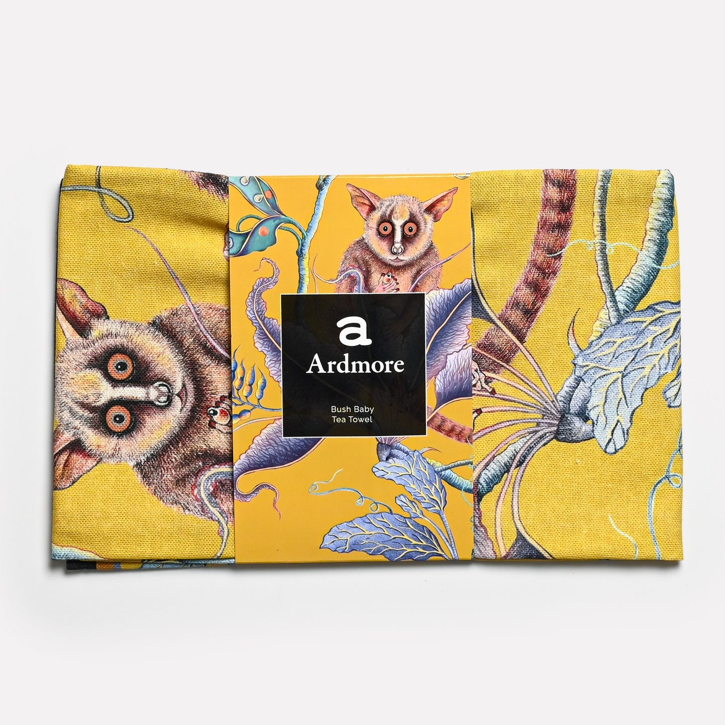 The tea towel in its original packaging, highlighting its premium quality and sophisticated African-themed aesthetic.