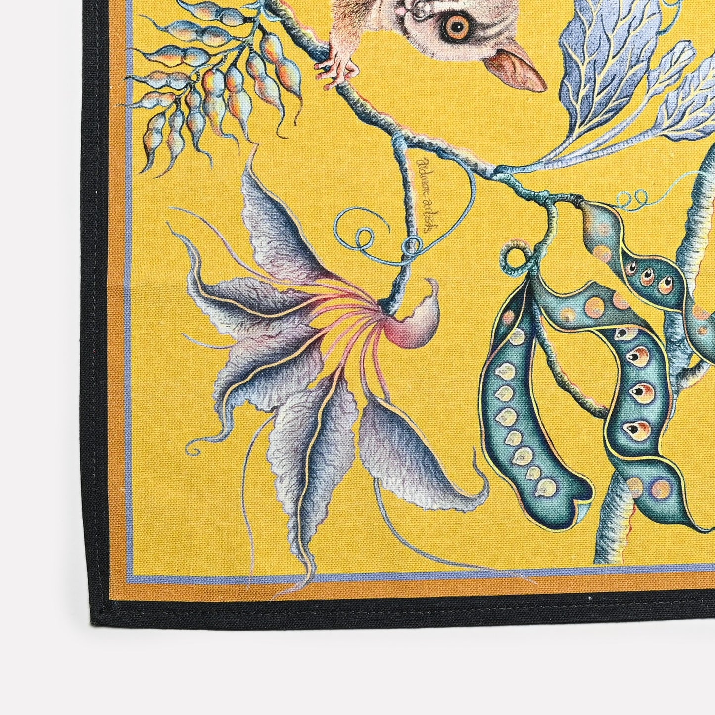 A detailed section showcasing the intricate illustration of bush babies surrounded by lush foliage, blending luxury and African-inspired artistry.