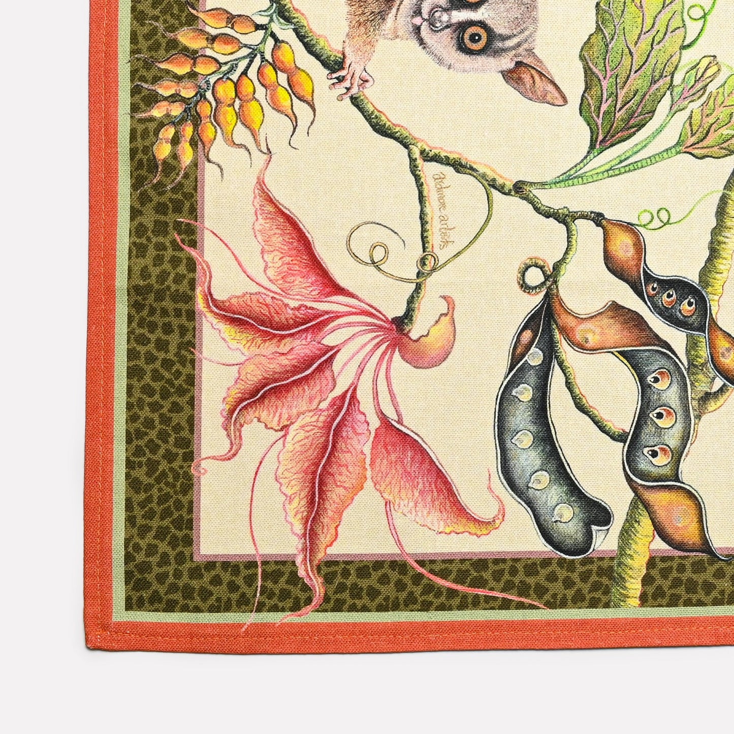 A detailed section showcasing the fine illustration of bush babies interacting with botanical elements in vibrant colours.