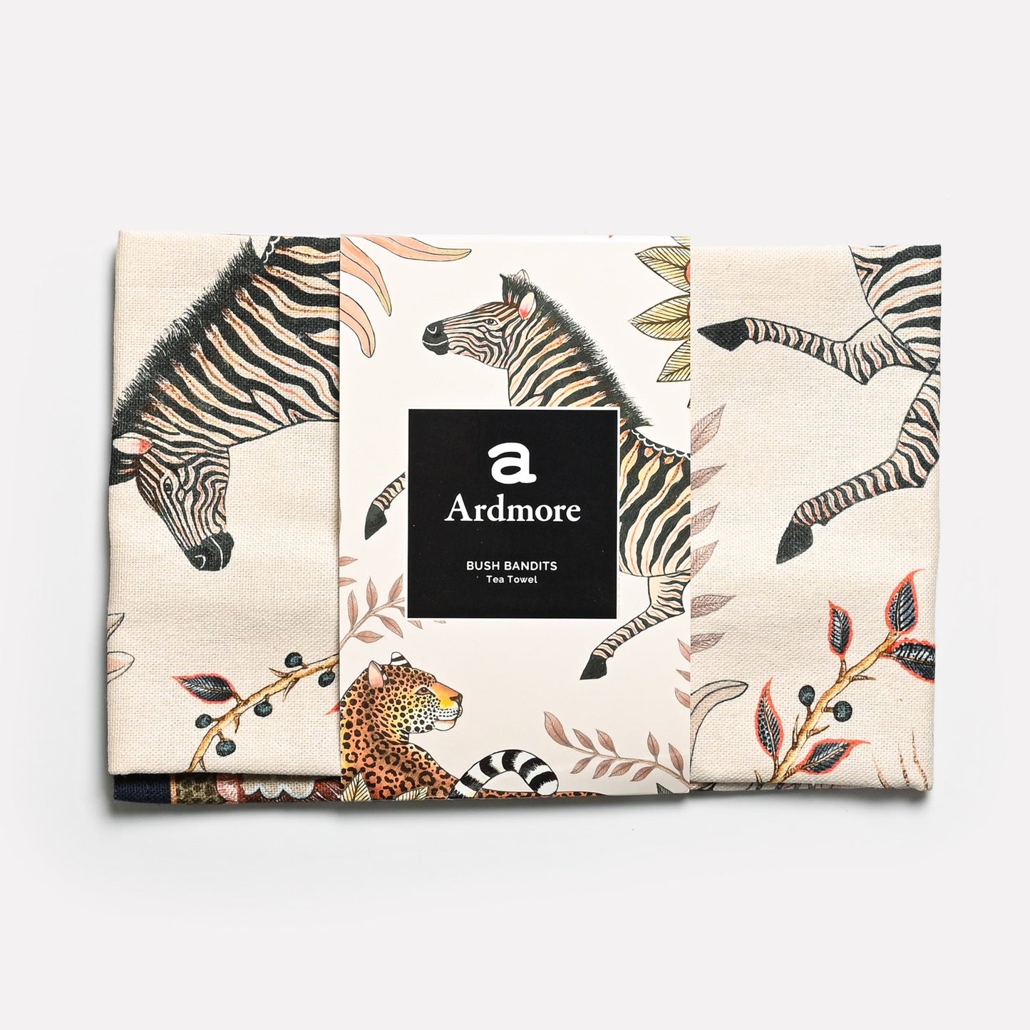 The tea towel in its original packaging, showcasing the high-quality craftsmanship and distinctive African artistry.