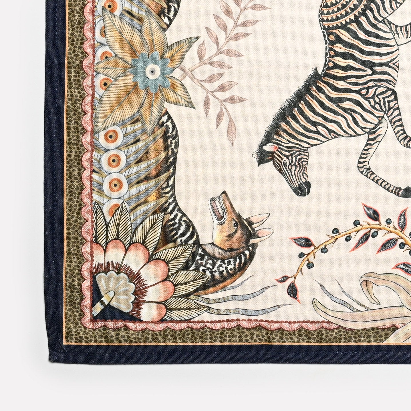 A zoomed-in section highlighting the fine details of the animal illustrations and textured fabric weave.