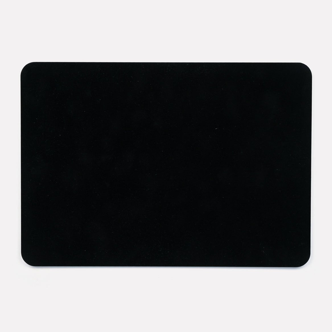 A solid black back of the placemat, displaying the smooth and durable finish.