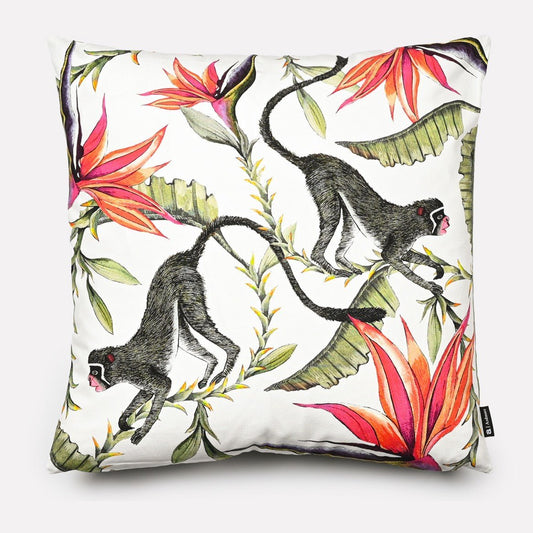 Front view of the Monkey Paradise Chalk Cushion Cover featuring a vibrant design with monkeys and bold red and green foliage on a white background.