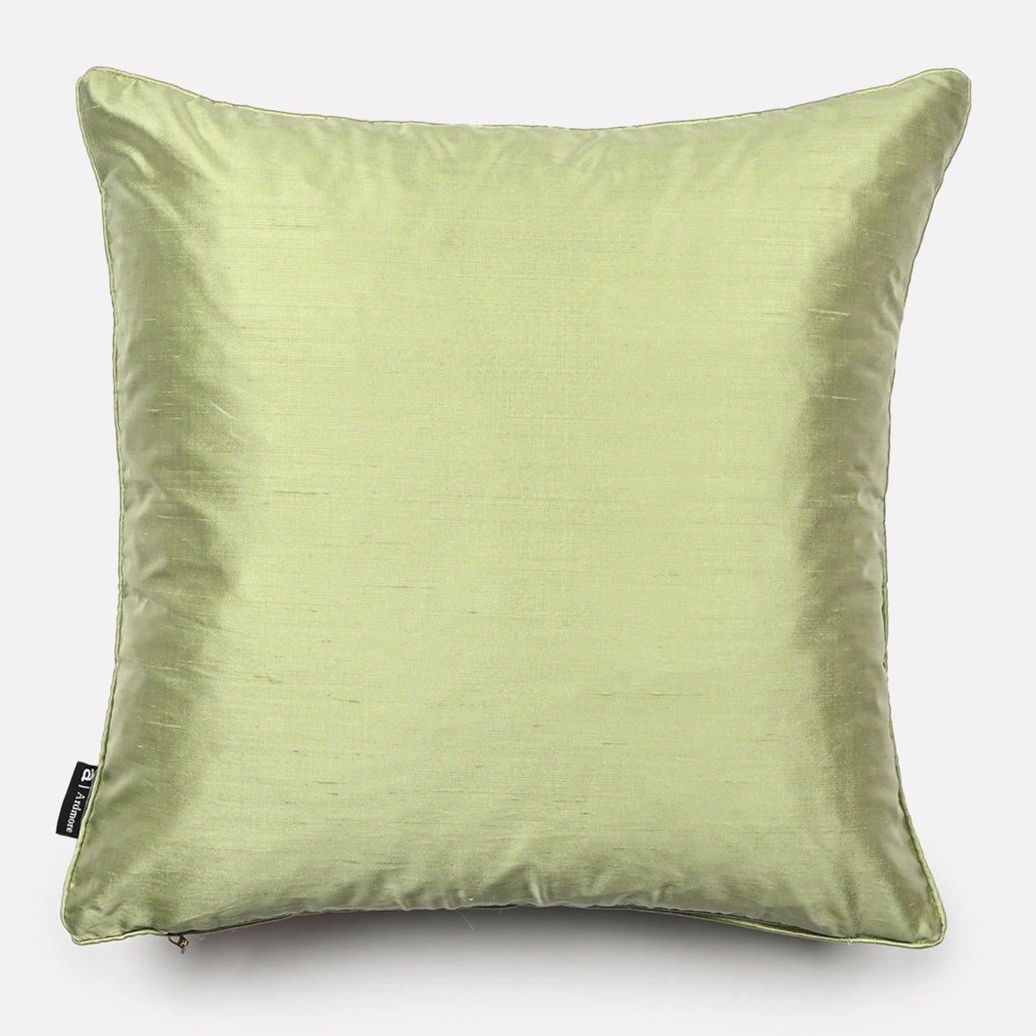 Cushion cover back in soft pistachio green silk, providing a smooth and elegant look, shown against a plain background.
