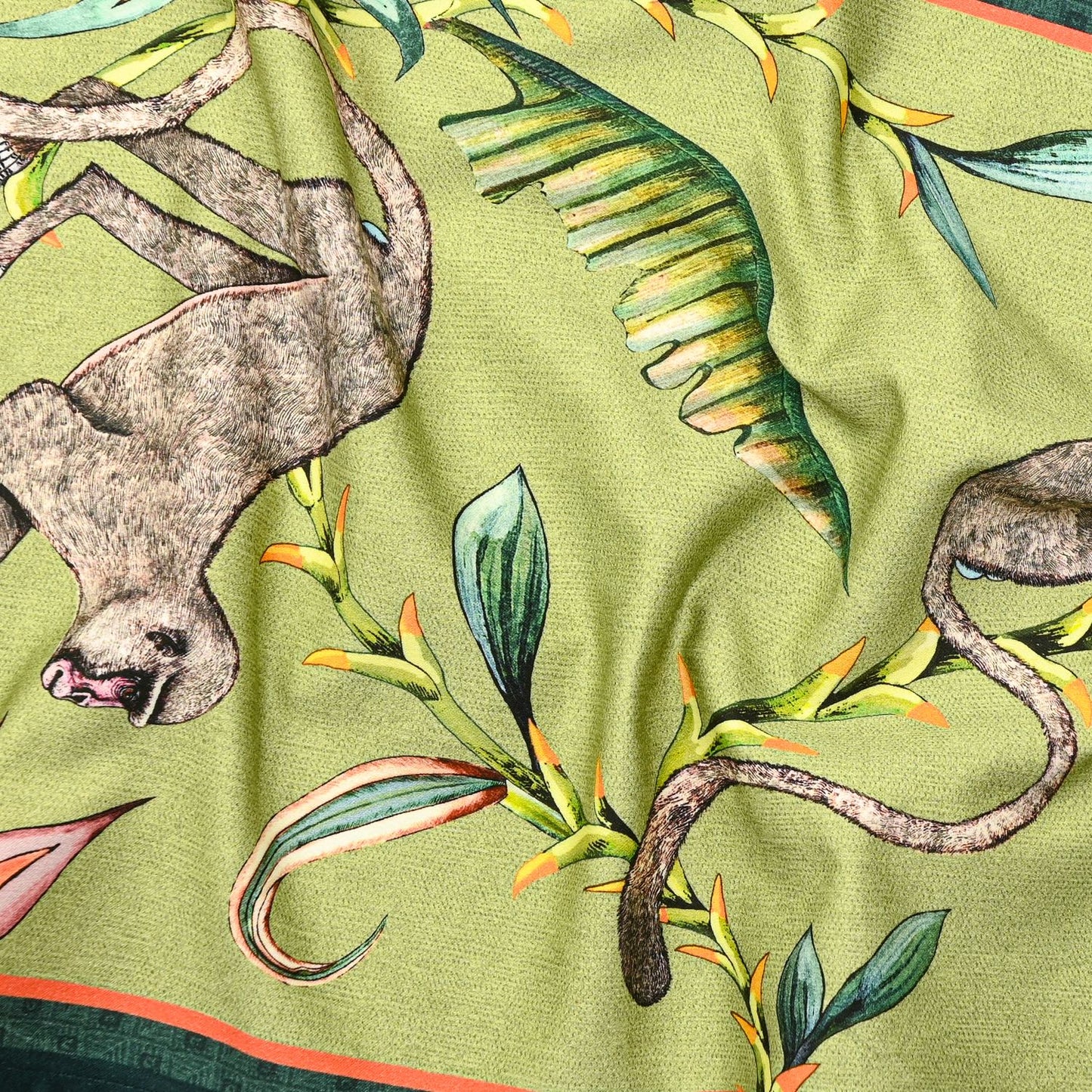 A zoomed-in section highlighting the fine artistic detailing of exotic animals and tropical foliage on the table runner.