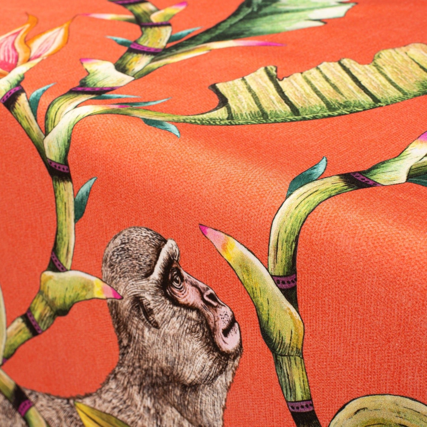 A detailed shot capturing a monkey motif on the fabric, showcasing the intricate brushwork and colour vibrancy.