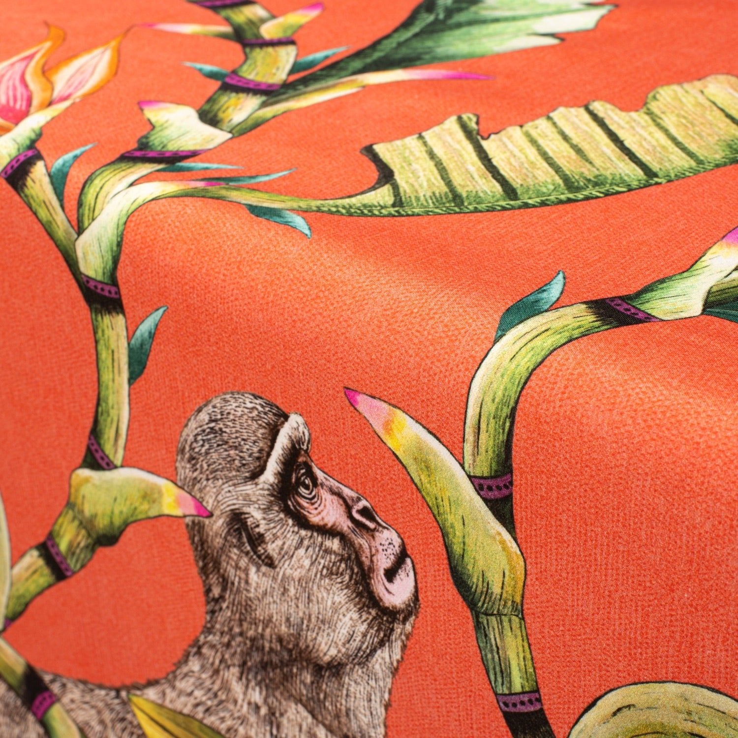 A detailed shot capturing a monkey motif on the fabric, showcasing the intricate brushwork and colour vibrancy.