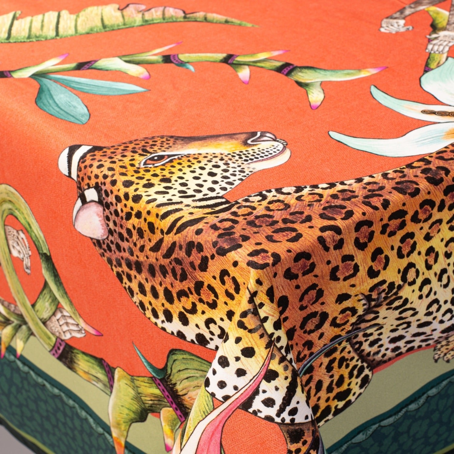 A macro shot highlighting a leopard illustration on the tablecloth, displaying the fine detailing and artistic craftsmanship.
