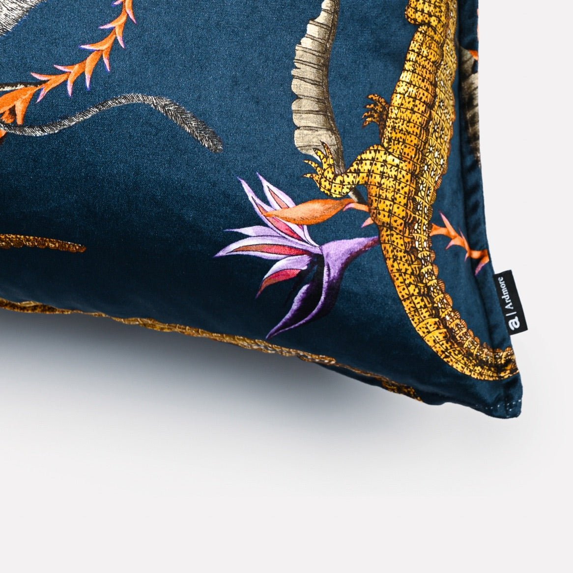 Close-up of the River Chase Royal Velvet Cushion Cover, highlighting the detailed gold crocodile and floral embroidery on velvet fabric.