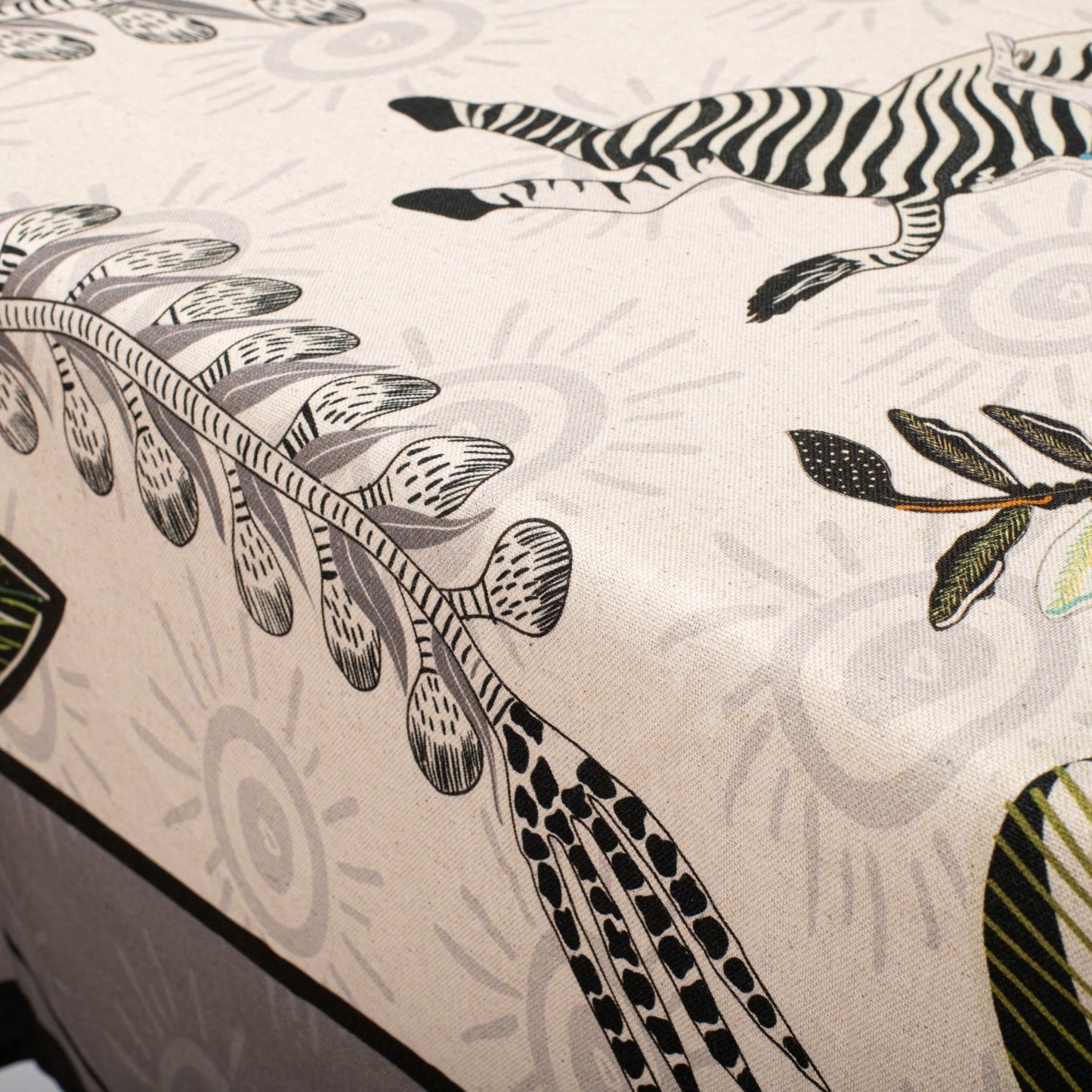 A zoomed-in view of the floral and botanical details, showcasing the delicate artistic patterns on the tablecloth.