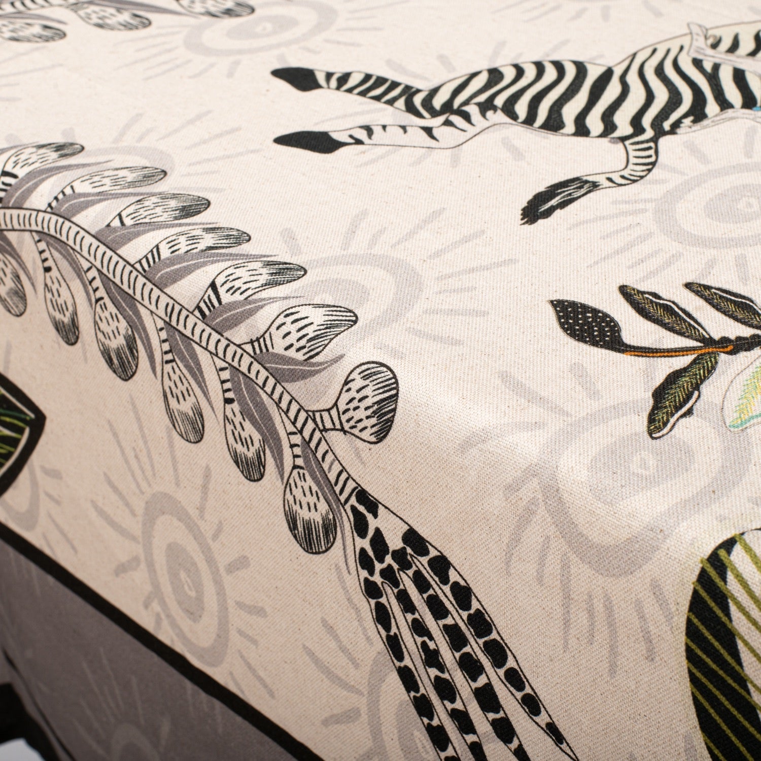 A zoomed-in view of the floral and botanical details, showcasing the delicate artistic patterns on the tablecloth.