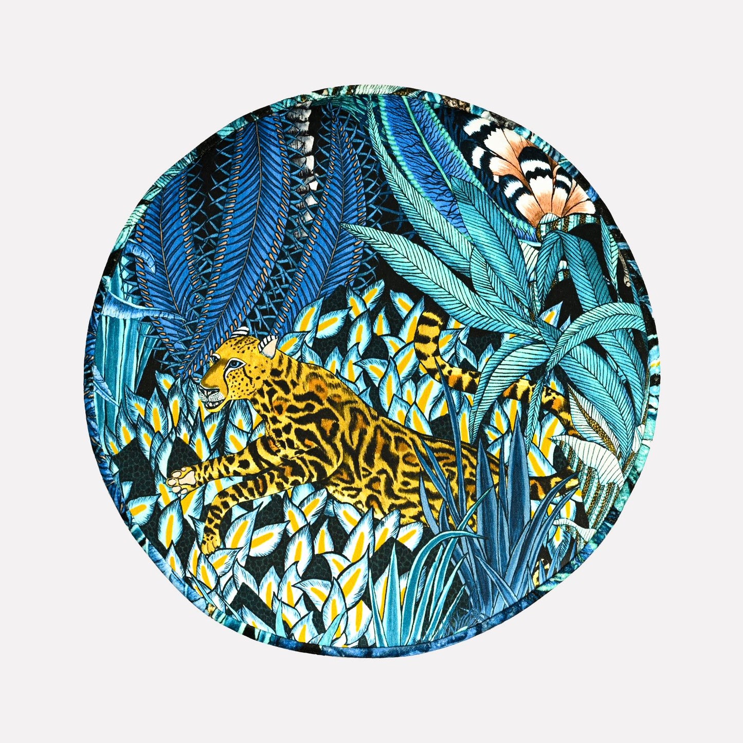 Top-down perspective of the Ardmore Sabie Forest Tanzanite Pouffe, revealing its rich, nature-inspired artwork in deep blue and gold hues, adding a regal touch to any space.