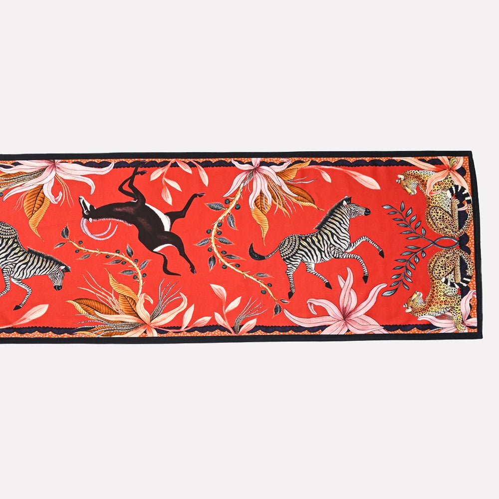 A close-up of a single Sable Runner laid flat, showcasing its detailed border and rich, nature-inspired design.