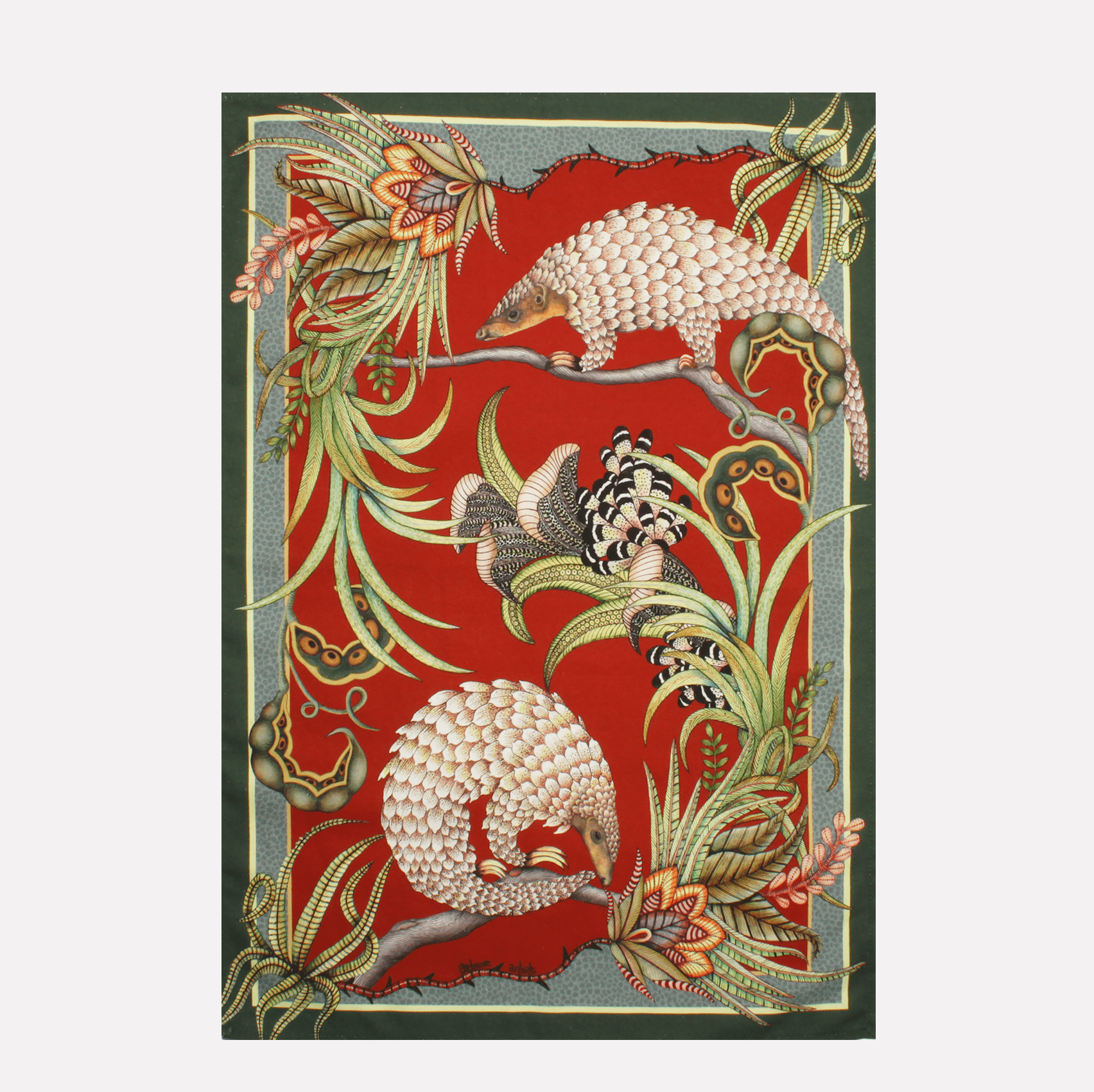 A vibrant tea towel featuring two intricately illustrated pangolins foraging in lush foliage, set against a rich red background.