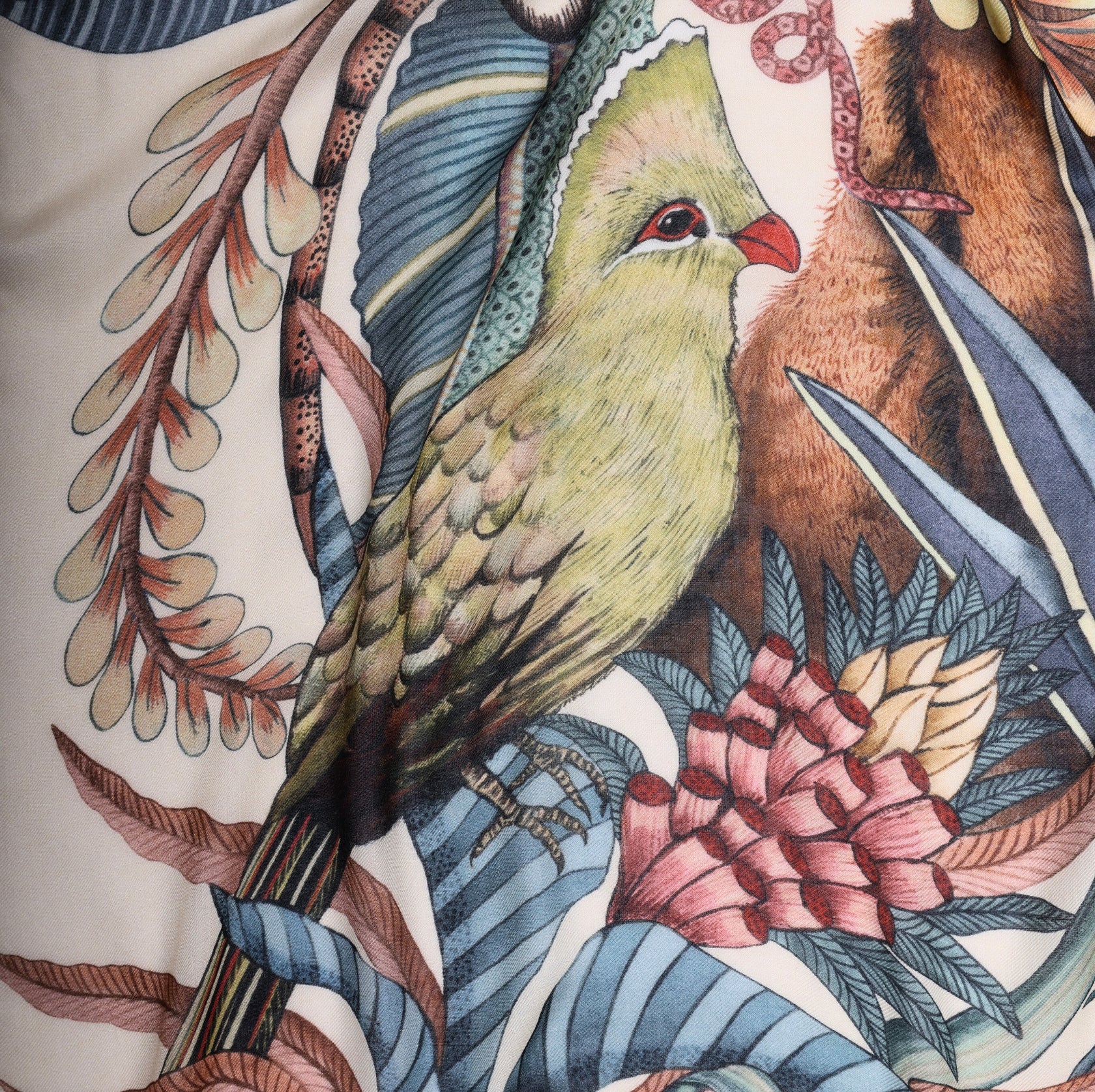 A focused section capturing the iridescent turaco bird perched amidst the foliage, adding a touch of elegance and contrast to the design.