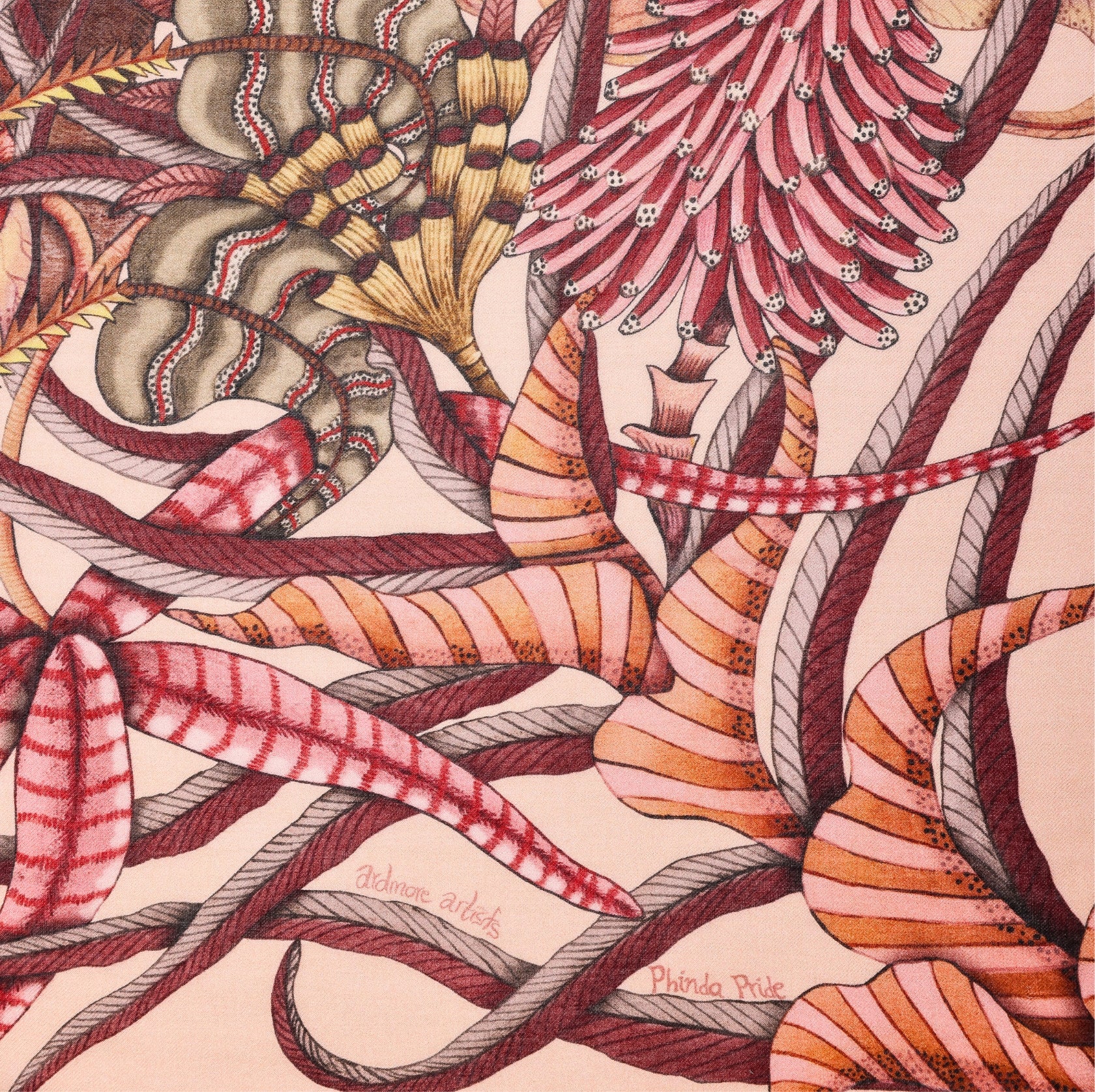 A zoomed-in view emphasising the elaborate plant motifs, rich in deep red, orange, and soft blush hues, adding texture to the design.