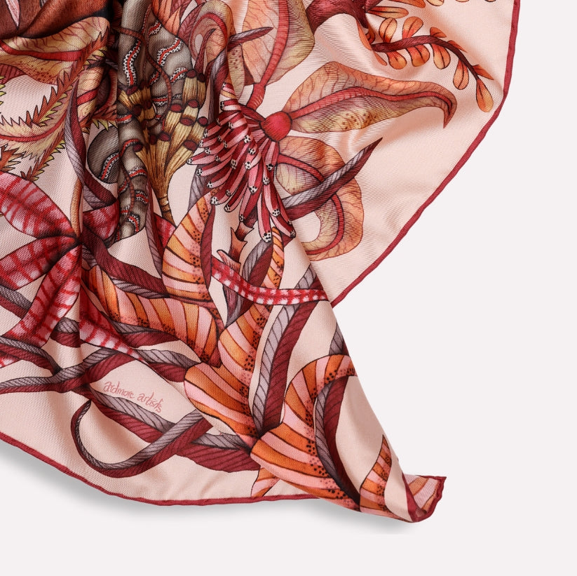 A soft, flowing display of the scarf, emphasising its luxurious silk texture and dynamic colour gradients.