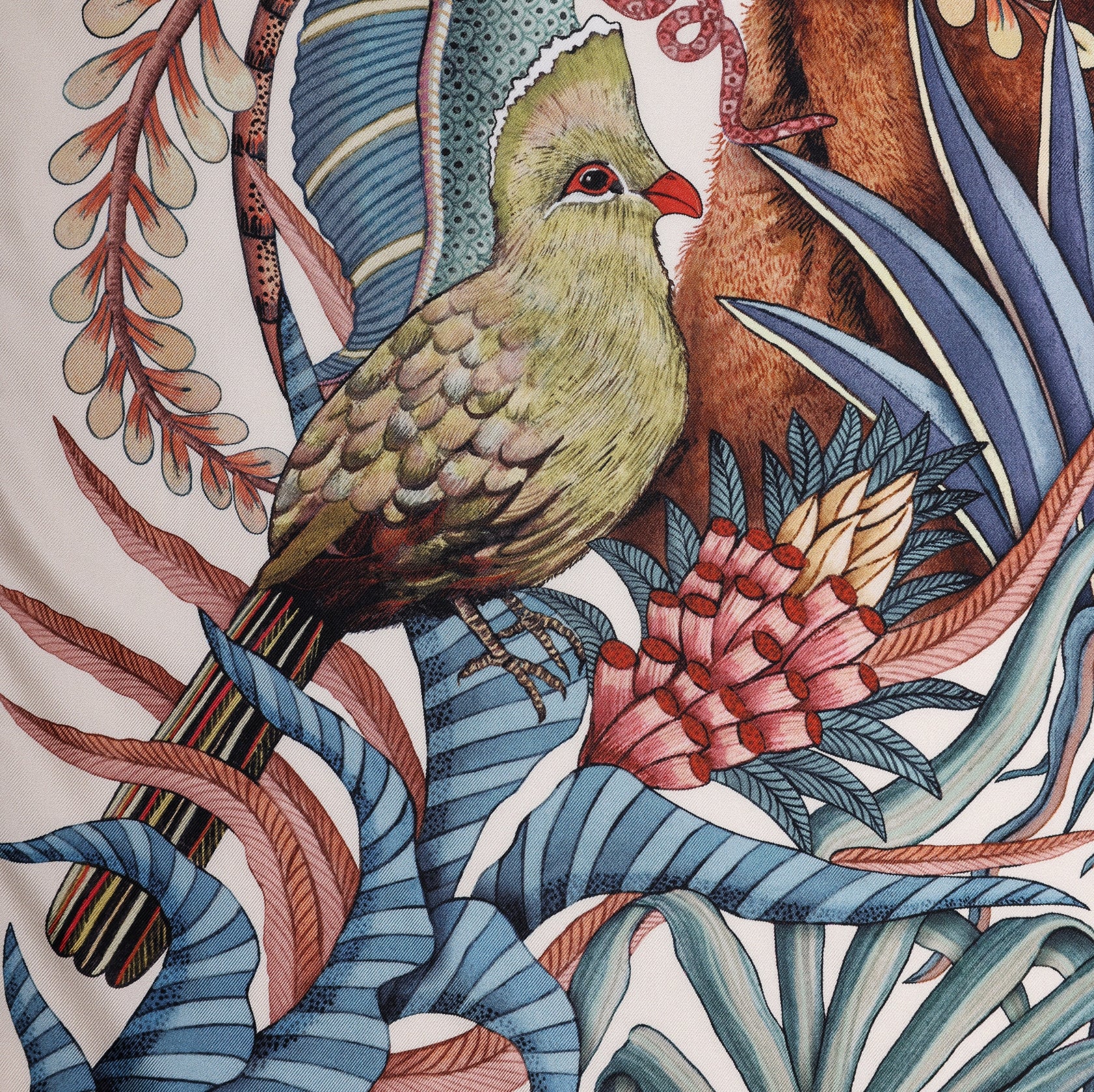 A close-up of a vibrant green turaco bird perched among the tropical flora, adding an exotic touch to the scarf.