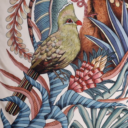 A close-up of a vibrant green turaco bird perched among the tropical flora, adding an exotic touch to the scarf.