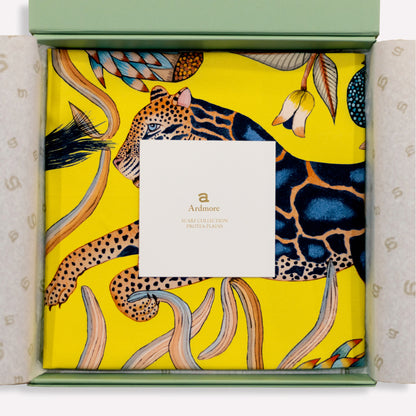 The scarf elegantly folded inside premium packaging, sealed with an official Ardmore Design label for an exquisite presentation.