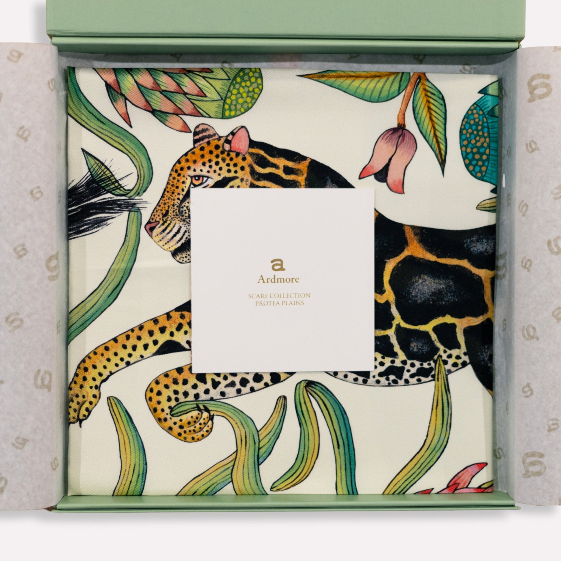The scarf elegantly folded inside its premium box, showcasing its presentation for gifting or luxury storage.