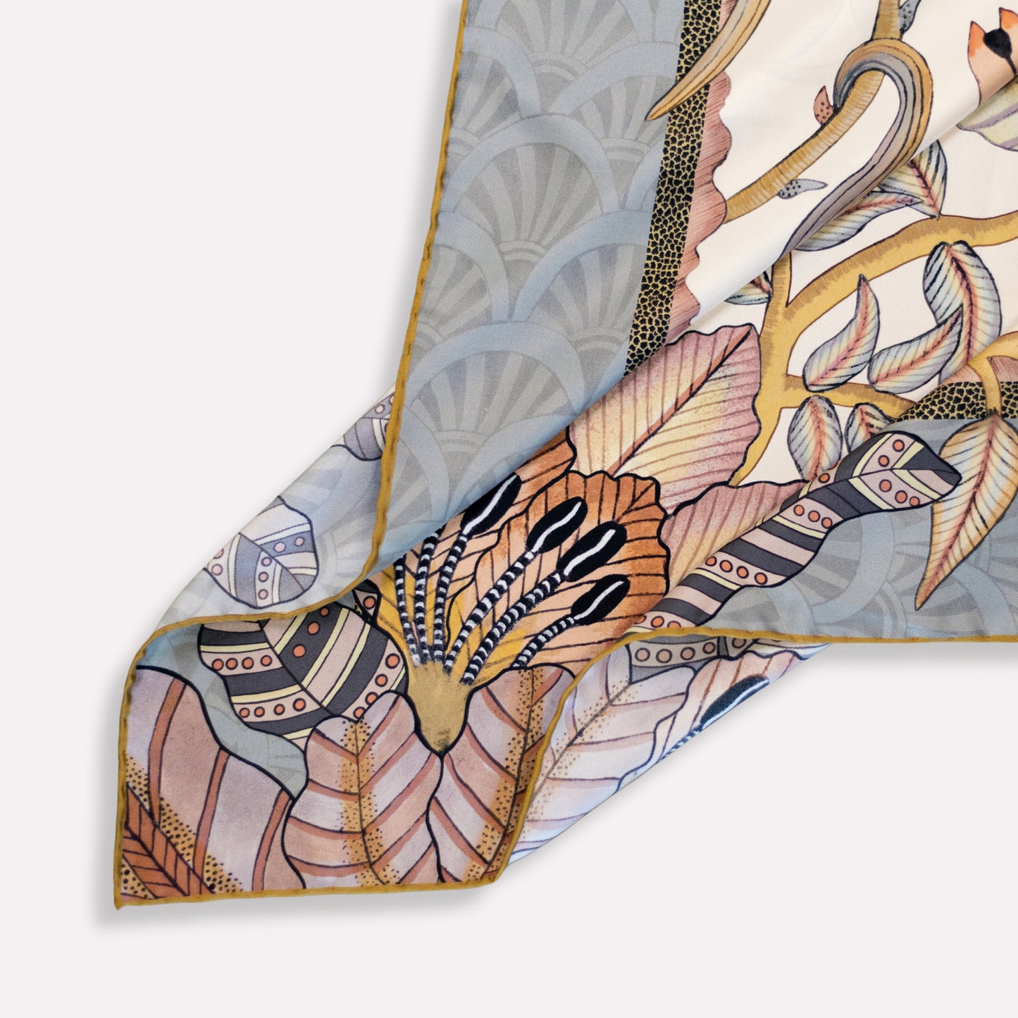 A final image showing the scarf neatly folded inside its premium packaging, highlighting its high-end presentation and gifting appeal.