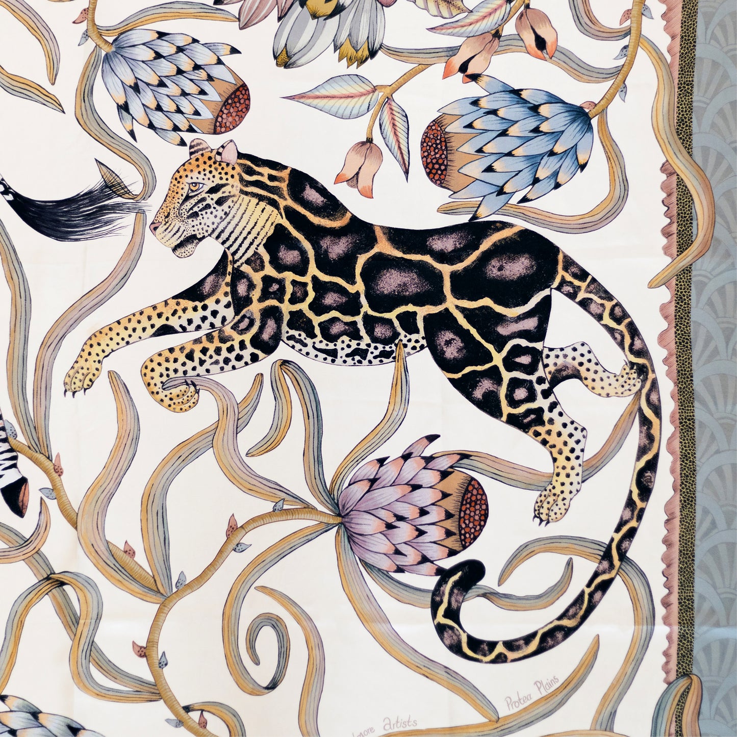 A detailed section capturing a poised leopard among swirling protea vines, emphasising the rich patterns and hand-drawn elegance.