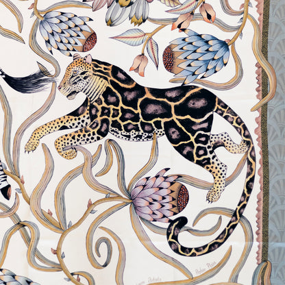 A detailed section capturing a poised leopard among swirling protea vines, emphasising the rich patterns and hand-drawn elegance.