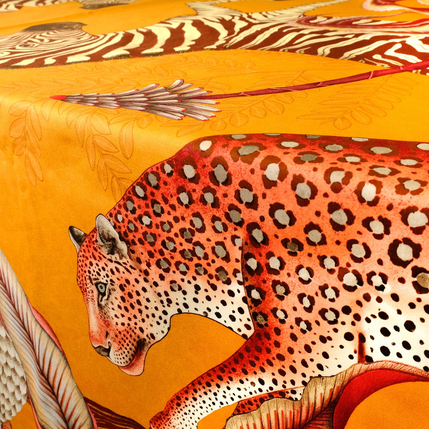 A tight shot focusing on a pangolin with bold striped patterns, demonstrating the textile’s striking visual contrast.