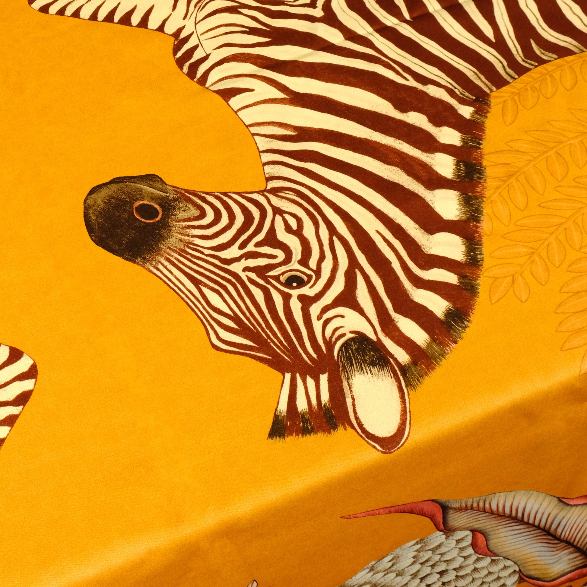 n extreme close-up of a zebra's head, showcasing the fine detailing of its facial markings and the intricacy of the surrounding floral and botanical elements.