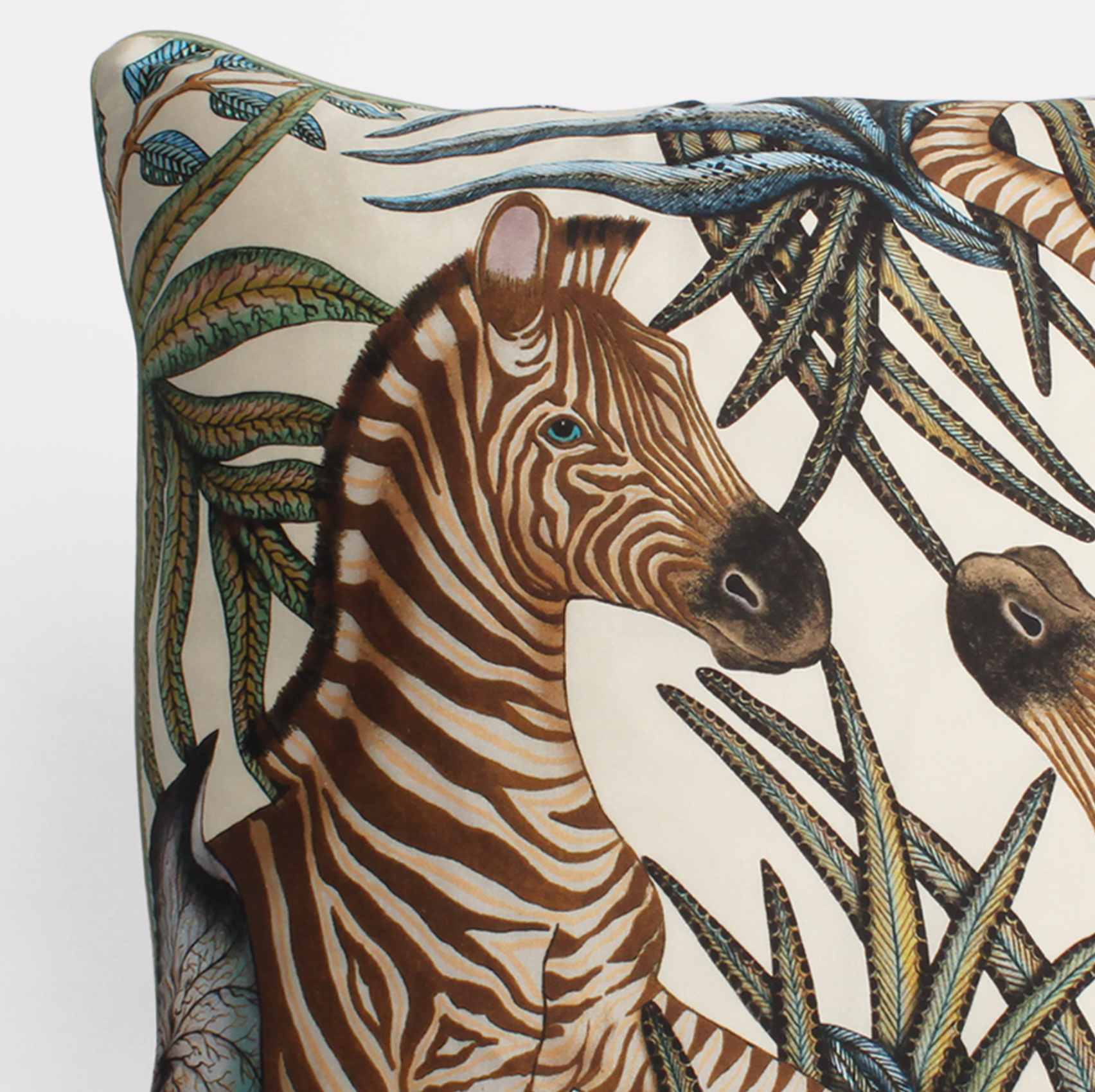 Angled side view showcasing the detailed double-sided print of the Thanda Stripe Tanzanite Silk Cushion Cover, highlighting the elegance of the zebras and lush foliage.
