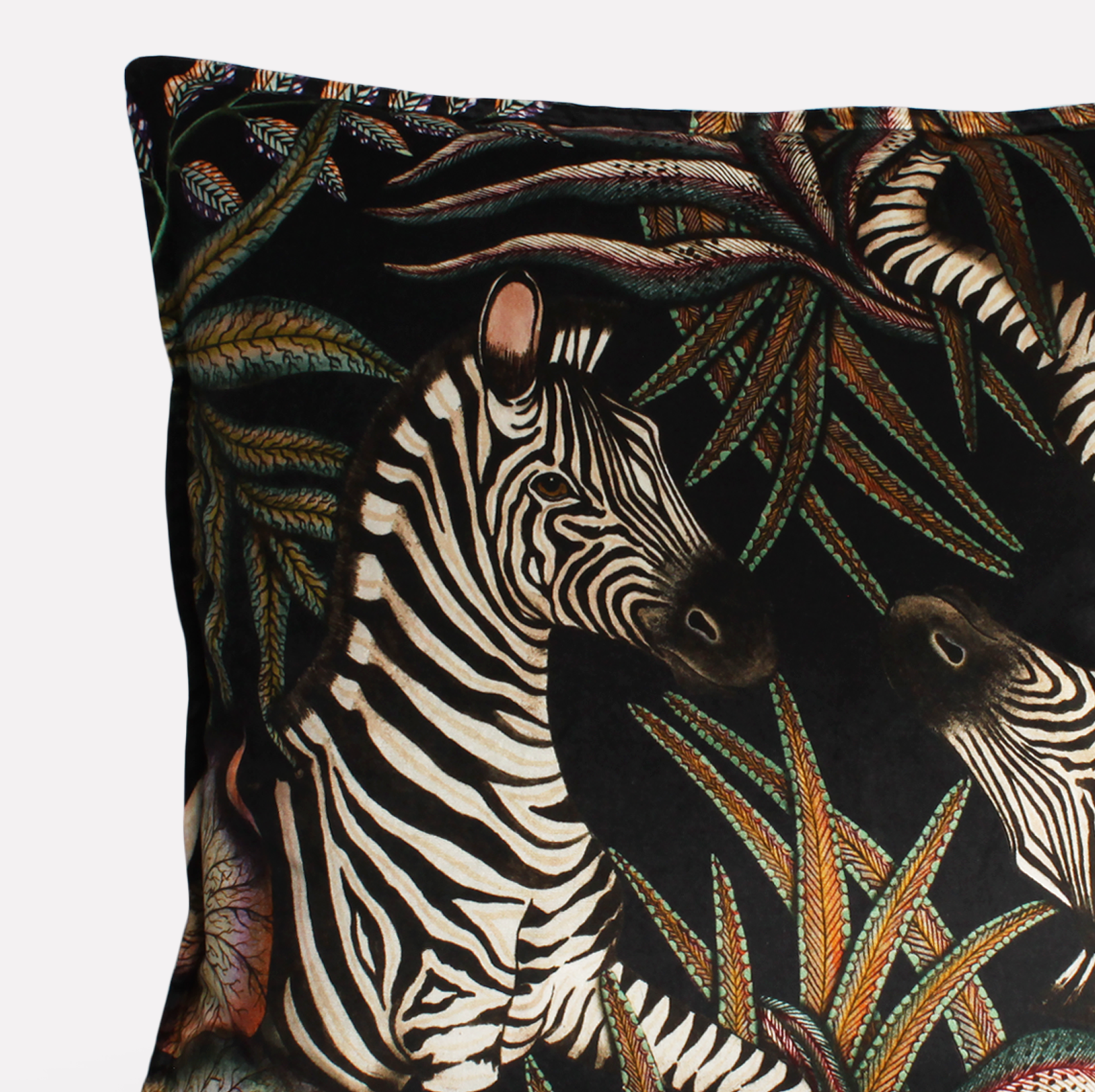 Side view of the Thanda Stripe Night Velvet Cushion Cover showcasing the intricate double-sided print with zebras and wild African flora.